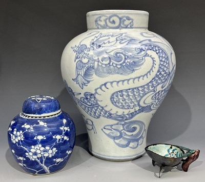 Lot 306 - An oriental baluster vase, decorated in a pale...