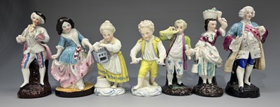 Lot 250 - A pair of glazed ceramic figures of a young...