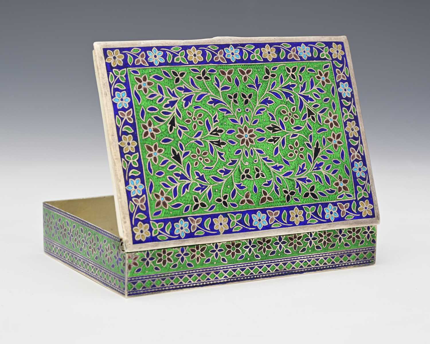 Lot 7 - An Eastern silver-coloured metal and enamel...