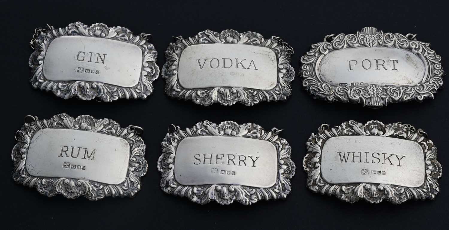 Lot 84 - Six Elizabeth II silver wine labels, to...