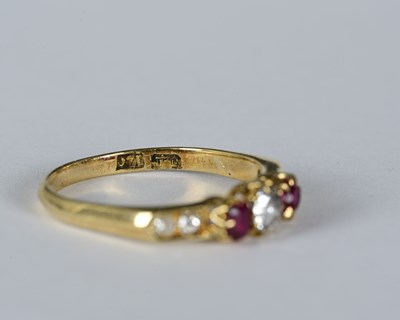 Lot 8 - An 18ct gold diamond and ruby dress ring