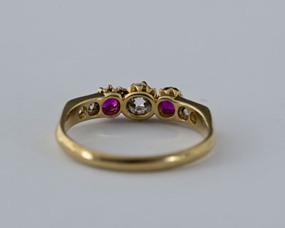 Lot 8 - An 18ct gold diamond and ruby dress ring