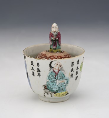 Lot 354 - A Chinese famille rose rising figure tea bowl,...