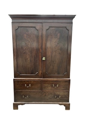Lot 984 - A Georgian mahogany linen press, dentilled...