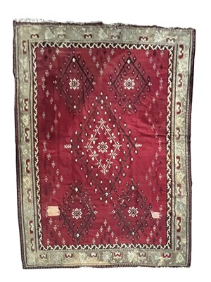 Lot 992 - A large Kilim type rug, in reds, blues, creams...