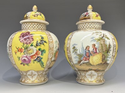 Lot 238 - A pair of 19th century Dresden lidded baluster...