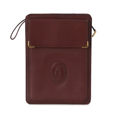 Lot 264 - Cartier, a vintage Bordeaux clutch bag.