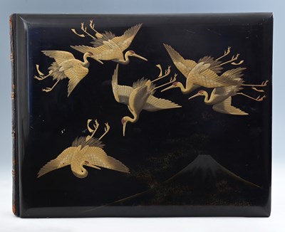 Lot 377 - A Japanese black lacquer photograph album,...