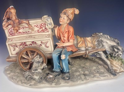 Lot 254 - A signed Capodimonte style figure of a boy...