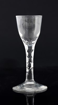 Lot 395 - A facet stem wine glass, circa 1780, the ovoid...