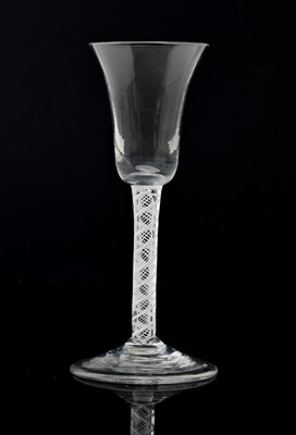 Lot 389 - An opaque twist wine glass, circa 1760, the...