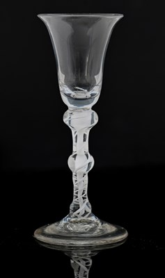 Lot 390 - An opaque twist wine glass, circa 1760, the...