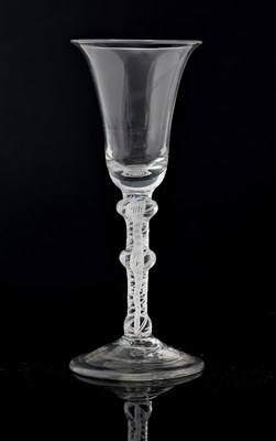 Lot 391 - An opaque twist wine glass, circa 1760, the...