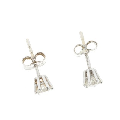 Lot 54 - A pair of 18ct gold brilliant-cut diamond single-stone stud earrings
