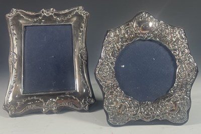 Lot 695B - Two silver mounted photo frames, decorated...