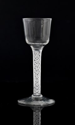 Lot 393 - An opaque twist wine glass, circa 1760, the...
