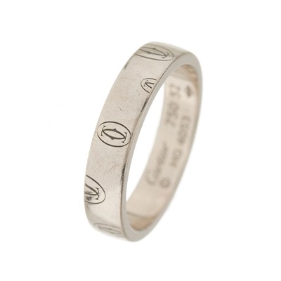 Lot 56 - Cartier, an 18ct white gold Happy Birthday logo band ring