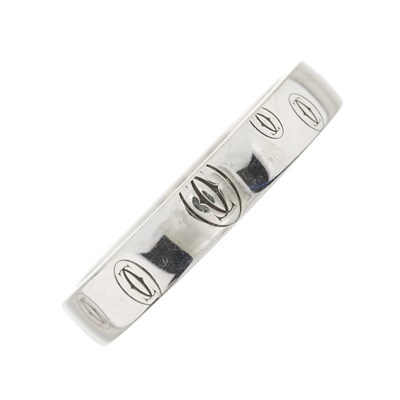 Lot 138 - Cartier, an 18ct white gold Happy Birthday logo band ring