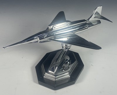 Lot 431 - A mid century chrome table lighter, formed to...