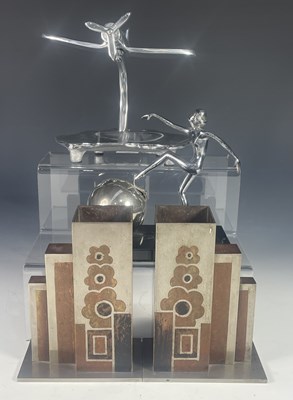 Lot 428 - An Art deco ashtray formed as a chrome dancing...