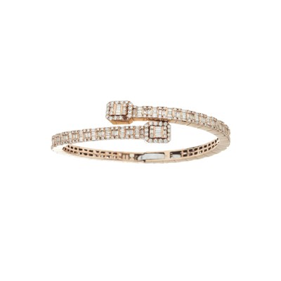 Lot 111 - A 9ct gold diamond crossover bangle bracelet