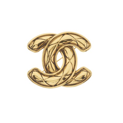 Lot 309 - Chanel, a vintage gold-tone quilted CC brooch pin.