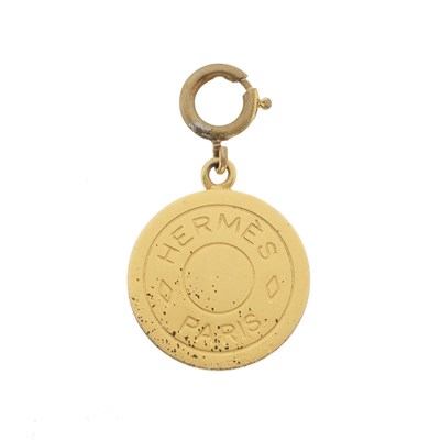 Lot 408 - Hermes, a gold-tone Clou de Selle pendant/charm.