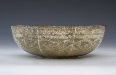 Lot 12 - A white metal bowl, panelled and stipple...