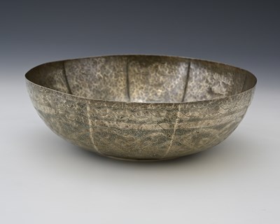 Lot 12 - A white metal bowl, panelled and stipple...