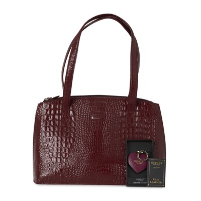 Lot 484 - Osprey, an embossed leather handbag w/ keyring.
