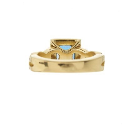 Lot 37 - An 18ct gold blue topaz and brilliant-cut...