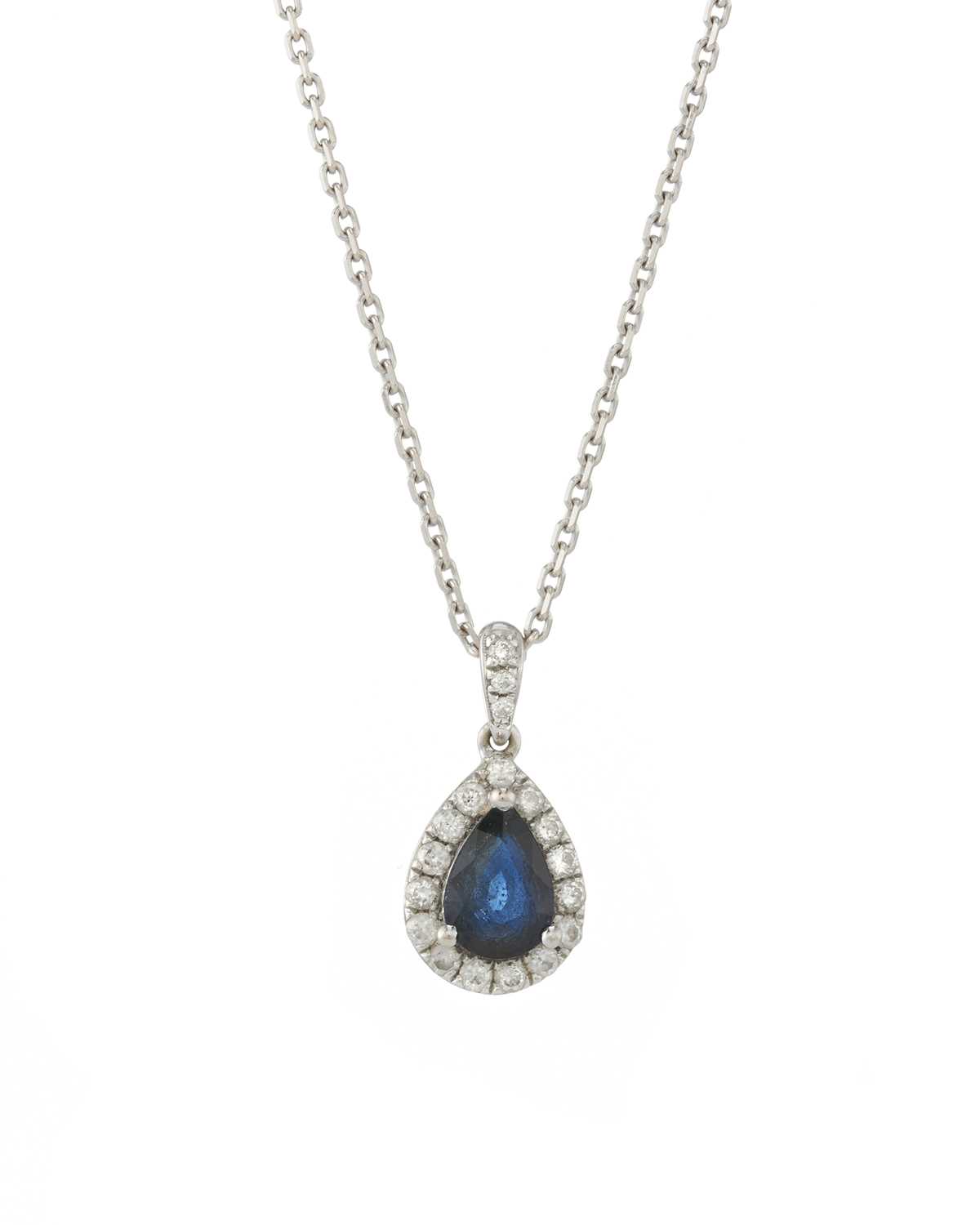 Lot 43 - An 18ct gold sapphire and diamond cluster pendant, with chain