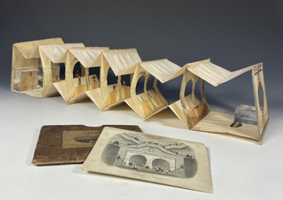 Lot 495 - An accordion form paper 'peep show' or tunnel...