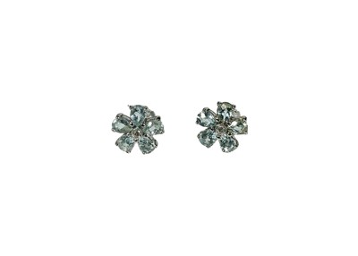 Lot 439 - A pair of 9ct gold blue topaz and diamond floral cluster stud earrings