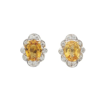 Lot 133 - A pair of 18ct gold yellow sapphire and diamond cluster stud earrings