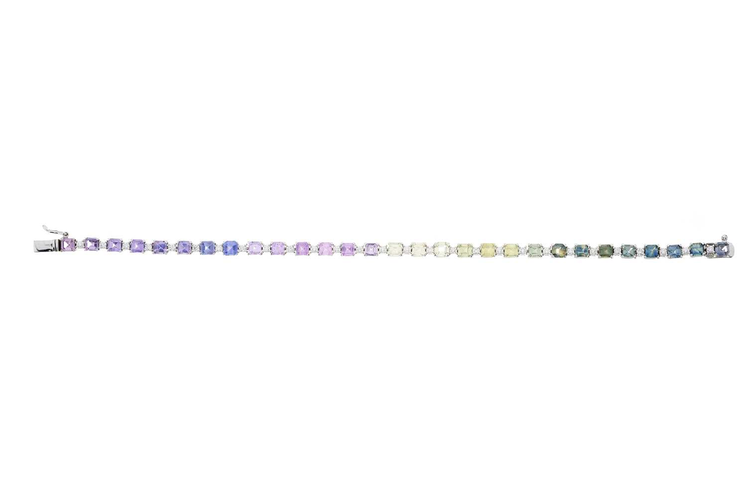 Lot 77 - A 14ct gold vari-hue harlequin sapphire and diamond line bracelet