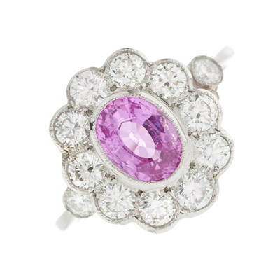 Lot 76 - A platinum pink sapphire and diamond cluster ring