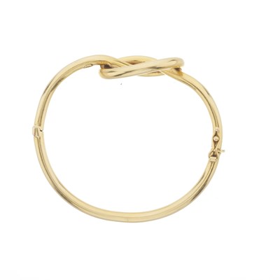Lot 67 - Ilias Lalaounis (attrib.), an 18ct gold love knot bangle bracelet