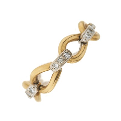 Lot 30 - A bi-colour gold diamond flexible ring