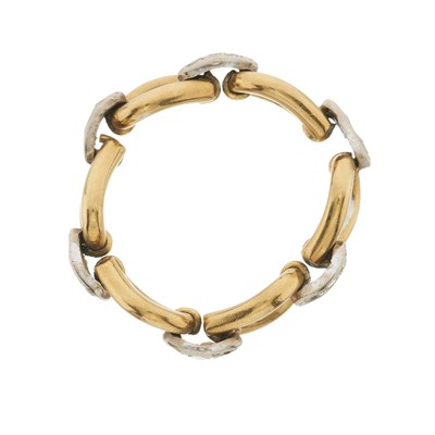 Lot 30 - A bi-colour gold diamond flexible ring