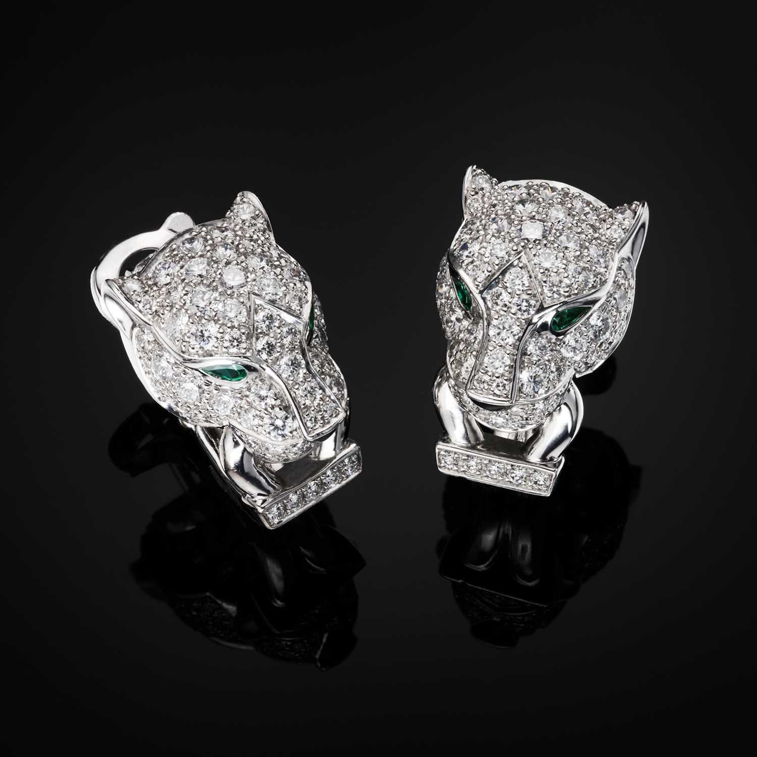 Lot 62 - Cartier, a pair of 18ct white gold diamond, emerald and onyx Panthere de Cartier earrings
