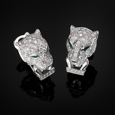 Lot 62 - Cartier, a pair of 18ct white gold diamond, emerald and onyx Panthere de Cartier earrings