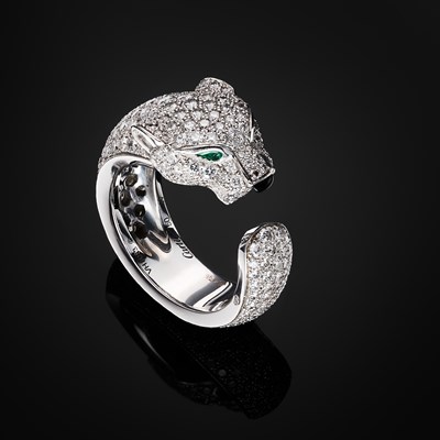 Lot 63 - Cartier, an 18ct white gold diamond, emerald and onyx Panthere de Cartier ring