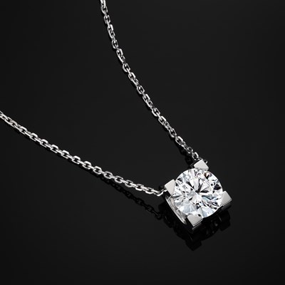 Lot 147 - Cartier, an 18ct white gold diamond C de Cartier single-stone necklace, of 1.36ct