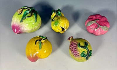 Lot 323 - A green glazed porcelain lidded pot, formed as...