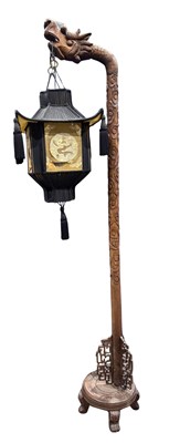 Lot 946A - A Chinese hardwood standard lamp, on four...