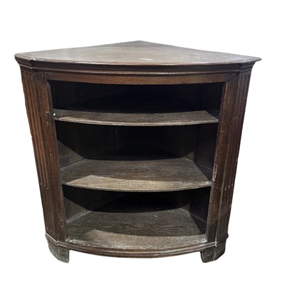Lot 934 - An 18th century oak floor standing corner unit,...