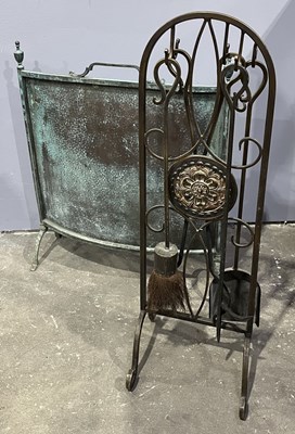 Lot 30 - A wrought metal companion set, bronzed finish,...