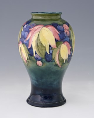 Lot 556 - William Moorcroft, a Leaf and Berry vase,...