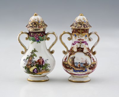Lot 500 - A near pair of scent bottles modelled as...